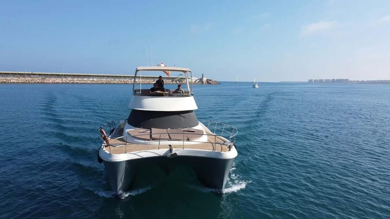 Puerto del Carmen: Private Sunset Catamaran Tour with Drinks - Puerto Calero, Playa Quemada, and Punta Gorda From Offshore