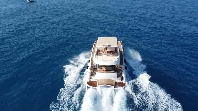 Puerto del Carmen: Private Sunset Catamaran Tour with Drinks - Sunset Behind Los Ajaches