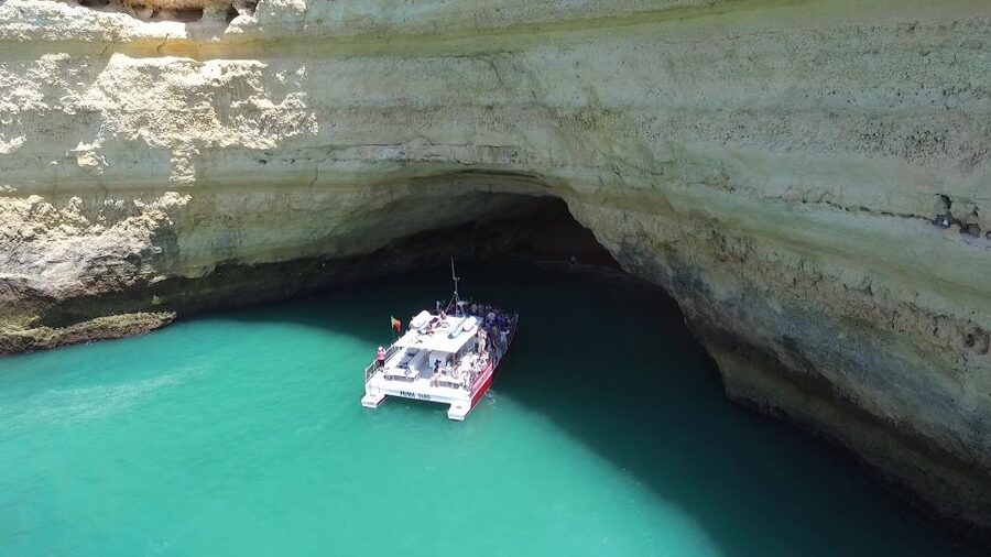 Quarteira: Benagil Cave Guided Catamaran Day Cruise & Drink - Cruising the Algarve coast for about 100 minutes