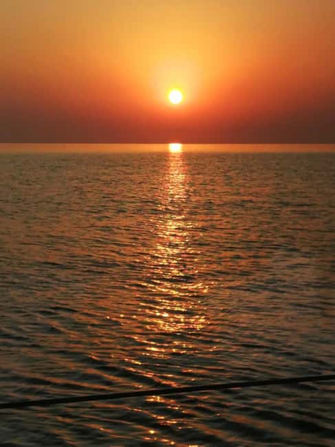 Rhodes: Sunset Catamaran Cruise with Snack, Fruits & Drinks - Fruit, cold drinks, and an easygoing boat mood