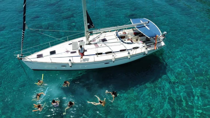 Rhodes: Sunset Catamaran Cruise with Snack, Fruits & Drinks - Sunset views near Elli Beach