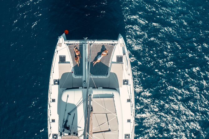 Romantic Sunset Catamaran Caldera Cruise incl. Meal & Drinks - Sunset near Oia and Ammoudi Bay