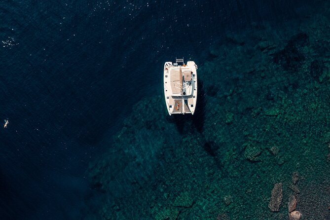 Romantic Sunset Catamaran Caldera Cruise incl. Meal & Drinks - Pickup, ports, and the first hour