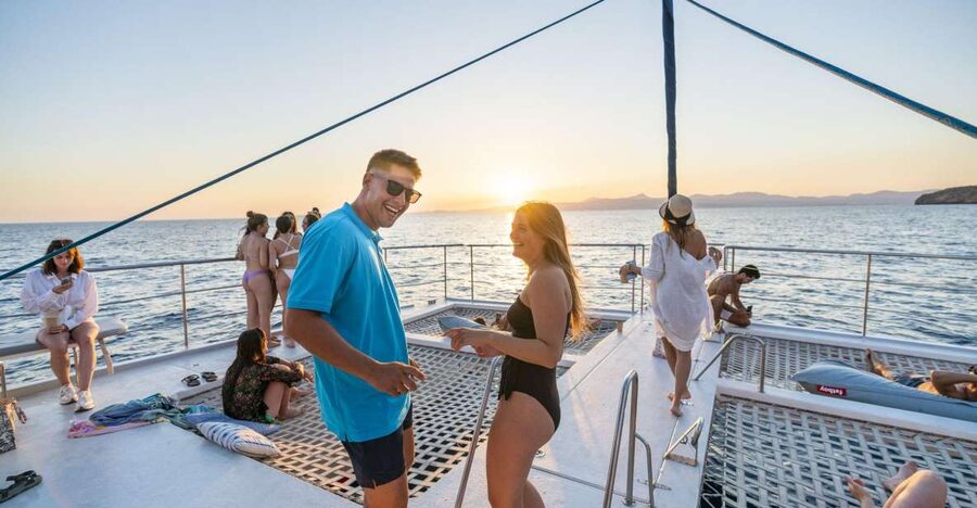 S'Arenal: Sunset Catamaran Cruise with BBQ - Cap Enderrocat and Cala Vella