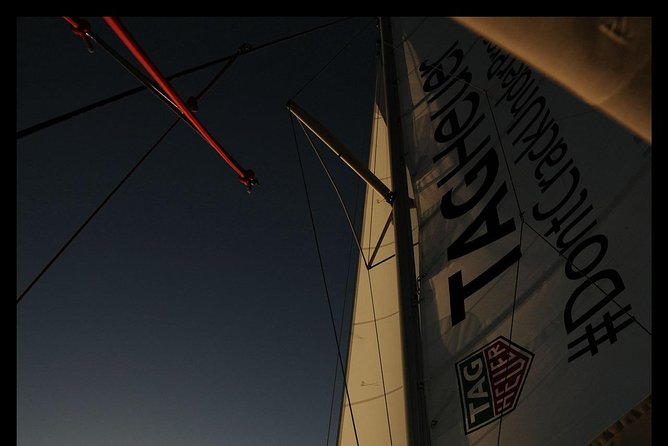 Santorini Adventurous Catamaran Experience with Snorkeling - Barbecue lunch, wine, and the social side