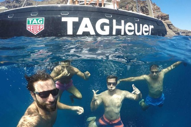Santorini: Adventurous Catamaran Experience with Snorkeling - From Fira to Vlychada Port