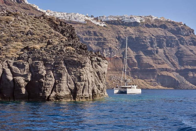 Santorini: Caldera Classic Catamaran Cruise w/ Meal & Drinks - The Akrotiri Lighthouse and volcanic Nea Kameni