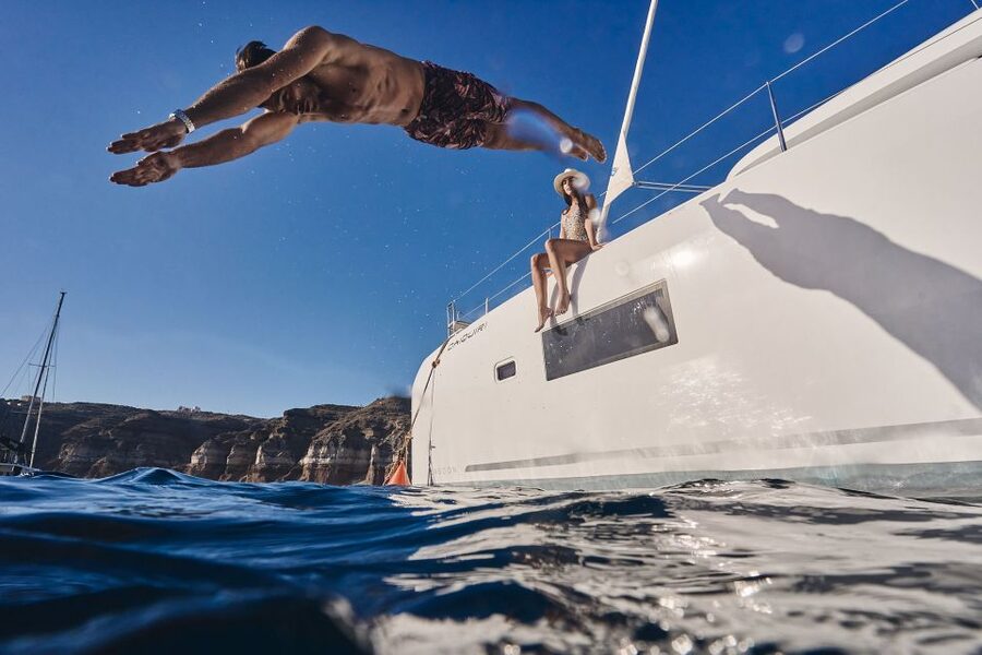 Santorini: Caldera Luxury Catamaran Cruise w/ Meal & Drinks - Red Beach: a striking first swim