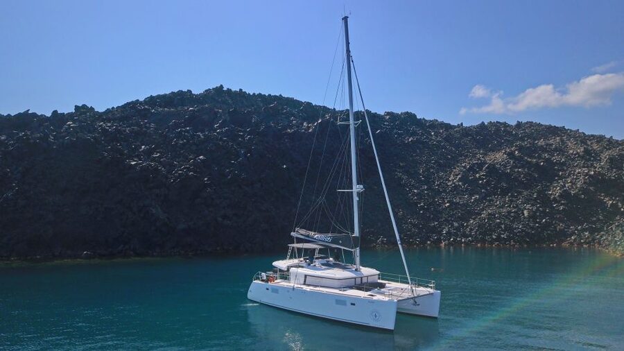 Santorini: Caldera Luxury Catamaran Cruise w/ Meal & Drinks - The sunset return to Santorini’s Old Harbor