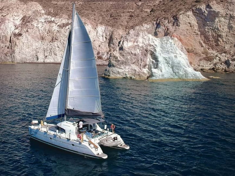 Santorini: Catamaran Cruise with Food and Drinks - Red Beach gives the first big color change