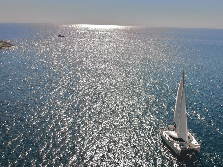 Santorini: Catamaran Cruise with Food and Drinks - White Beach is a quick photo stop