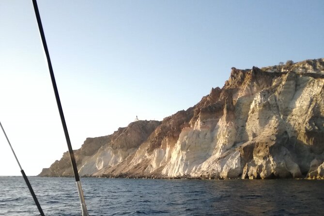 Santorini Catamaran Cruise with Fresh Meal and Open Bar - Mesa Pigadia and the changing volcanic coast
