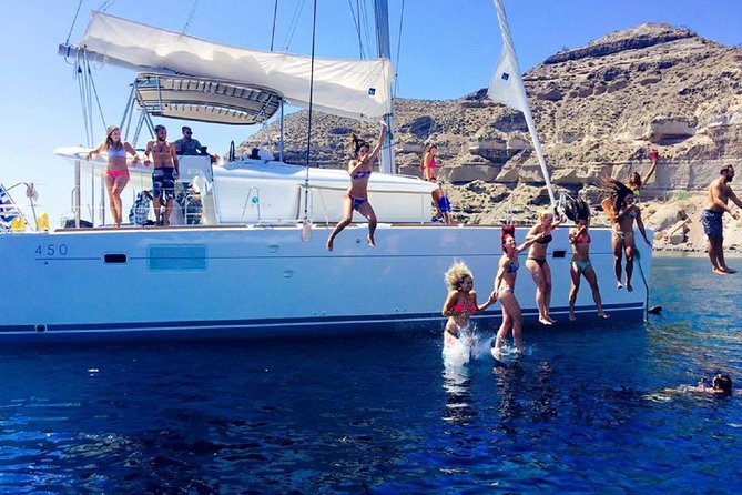 Santorini Catamaran Cruise with Fresh Meal and Open Bar - Swimming at the Santorini Hot Springs