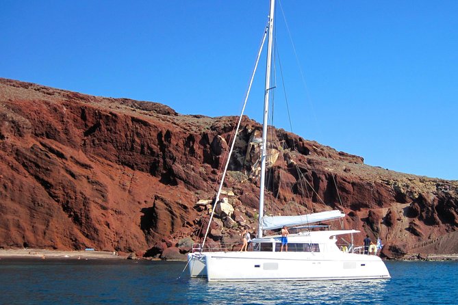 Santorini Catamaran Cruise with Fresh Meal and Open Bar - Open bar, music, and the sunset option