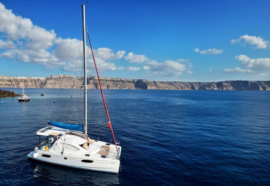 Santorini: Catamaran Cruise with Greek BBQ and Drinks - Red Beach: Santorini’s Volcanic Calling Card