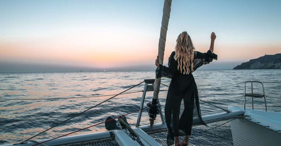Santorini Catamaran Cruise with Swimming, Meal and Open Bar - The return past Black Mountain and Indian Rock