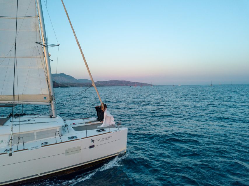 Santorini Catamaran Cruise with Swimming, Meal and Open Bar - Red Beach and the first swim