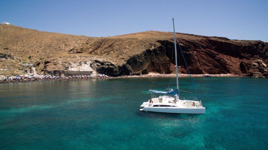 Santorini:Catamaran: private cruise with food & drinks - White Beach, reached only by boat