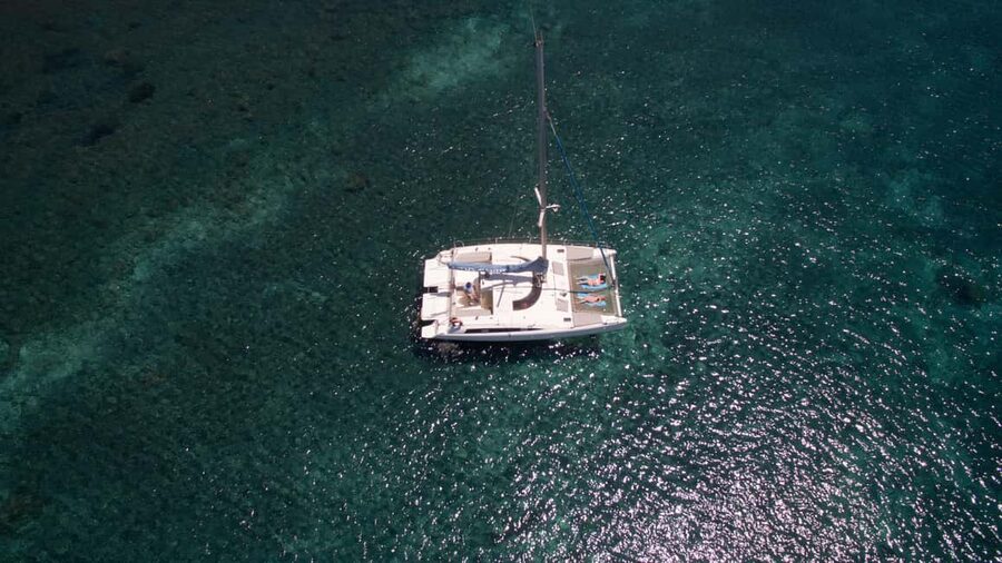 Santorini:Catamaran: private cruise with food & drinks - Black Mountain and Indian Rock