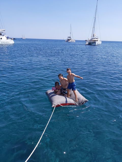 Santorini:Catamaran: private cruise with food & drinks - Swimming, snorkeling, and time on the boat