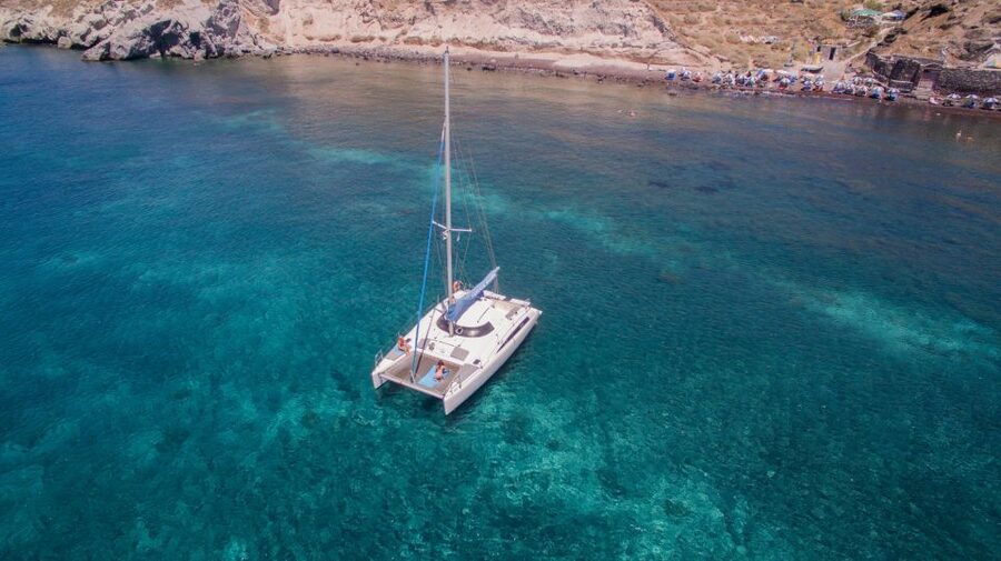 Santorini:Catamaran: private cruise with food & drinks - Sunset option and return to your hotel