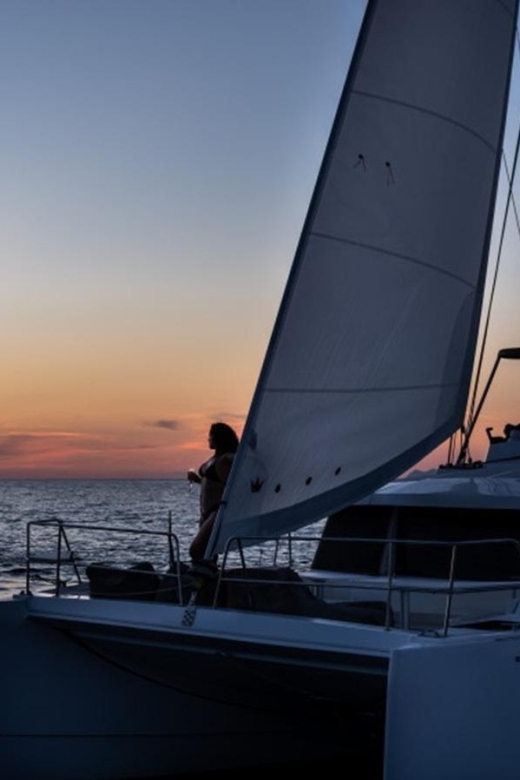 Santorini Catamaran Sunset Skyline Cruise - Red Beach: Santorini’s most dramatic first stop