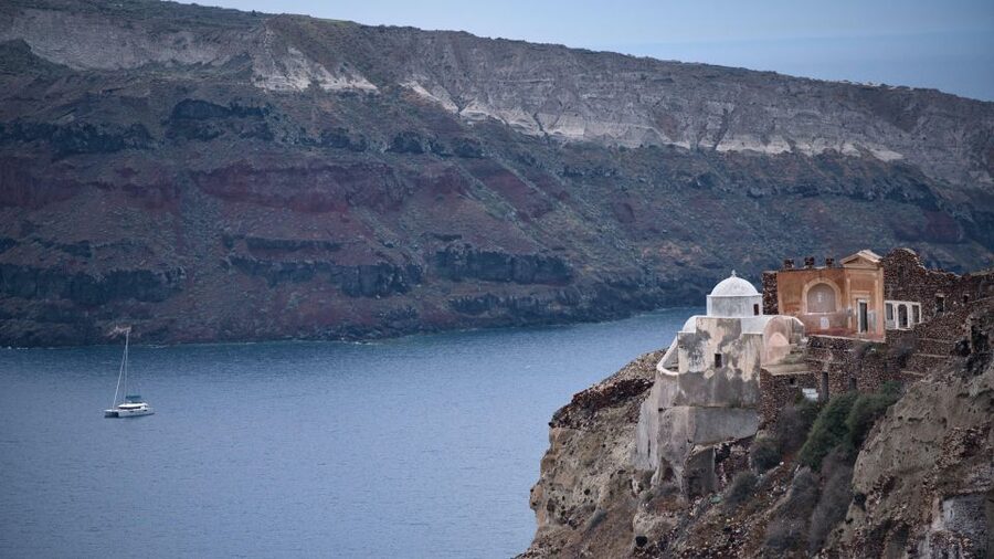 Santorini Catamaran Sunset Skyline Cruise - Akrotiri Lighthouse and the turn into the caldera