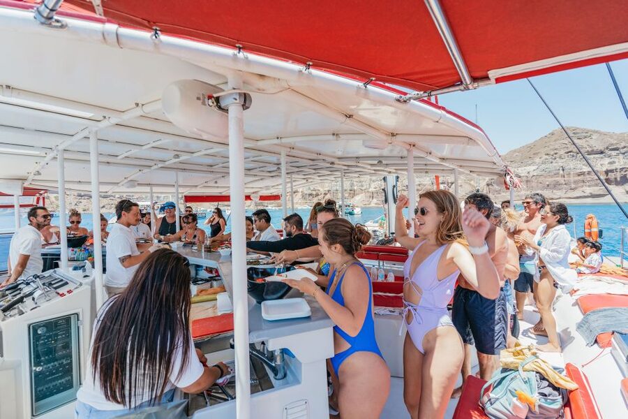 Santorini: Catamaran Tour with BBQ Dinner, Drinks, and Music - Sailing inside the caldera at sunset
