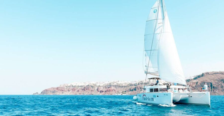 Santorini: Catamaran Tour with BBQ Meal and Unlimited Drinks - Hot Springs: warm volcanic water with a cool-water catch
