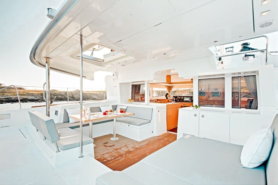 Santorini: Catamaran Tour with BBQ Meal and Unlimited Drinks - Sailing past Santorini’s volcanic landmarks
