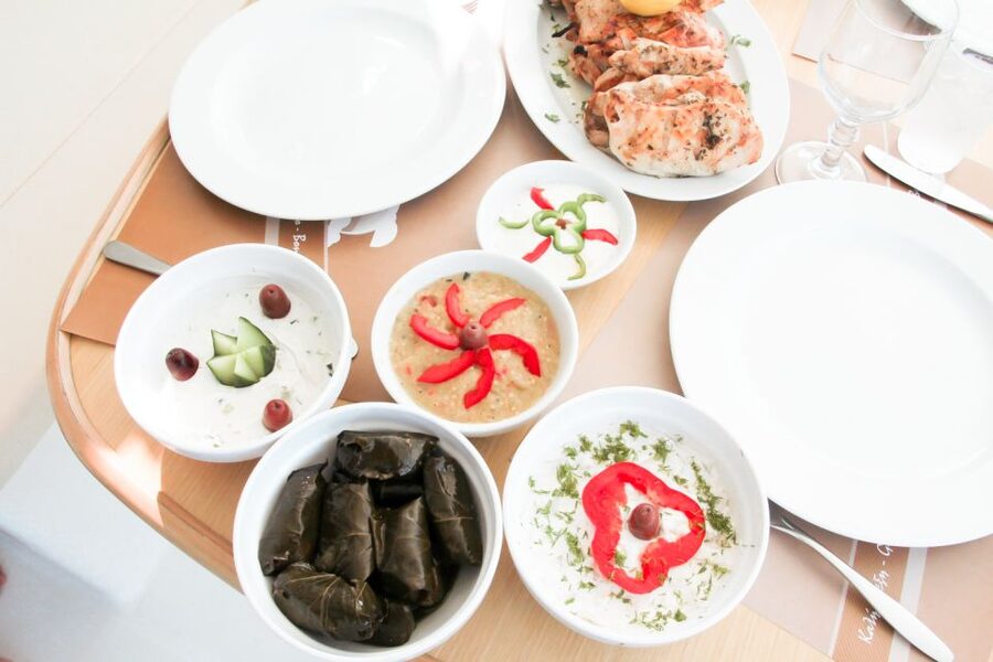Santorini: Catamaran Tour with BBQ Meal and Unlimited Drinks - Red Beach and snorkeling from the boat