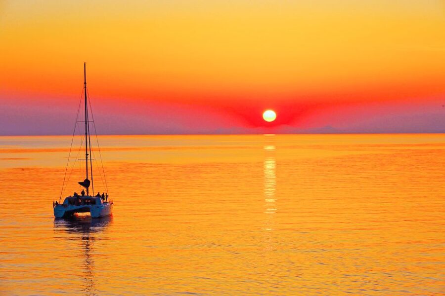 Santorini: Catamaran Tour with BBQ Meal and Unlimited Drinks - Crew service and the relaxed pace
