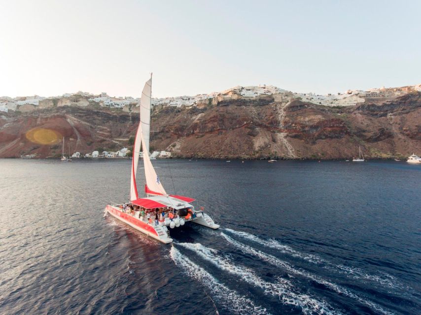 Santorini: Cruise Catamaran with BBQ & Drinks Day or Sunset - White Beach and the onboard Greek barbecue