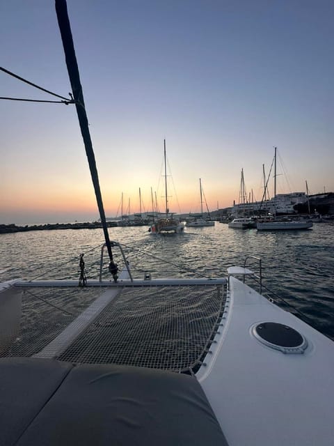 Santorini:Cruises with Catamaran around the Volcanic Island. - Volcanic thermal springs between the two Kameni islands