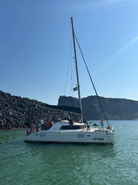 Santorini:Cruises with Catamaran around the Volcanic Island. - Mesa Pigadia, lunch, and a proper Greek spread