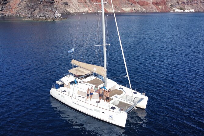 Santorini Gold Catamaran Cruise with BBQ, Drinks and Hotel Pickup - Pickup from your hotel and departure at Vlichada