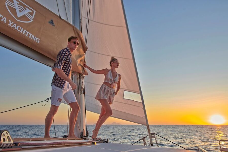 Santorini Gold Catamaran Cruise with Snorkel, BBQ & Open Bar - Watching the caldera cliffs from the sea