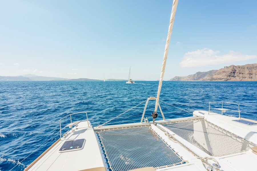 Santorini: Luxury Catamaran Day Trip with Meal and Open Bar - Pickup and the trip to the port