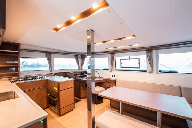 Santorini: Majestic Catamaran Cruise with Meal and Drinks - Sailing past Black Mountain and the southern lighthouse