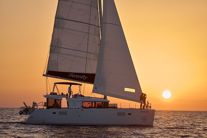 Santorini Oia: Private Sunset Catamaran Cruise with BBQ & Drinks - The Lighthouse at Santorini’s Southern Edge
