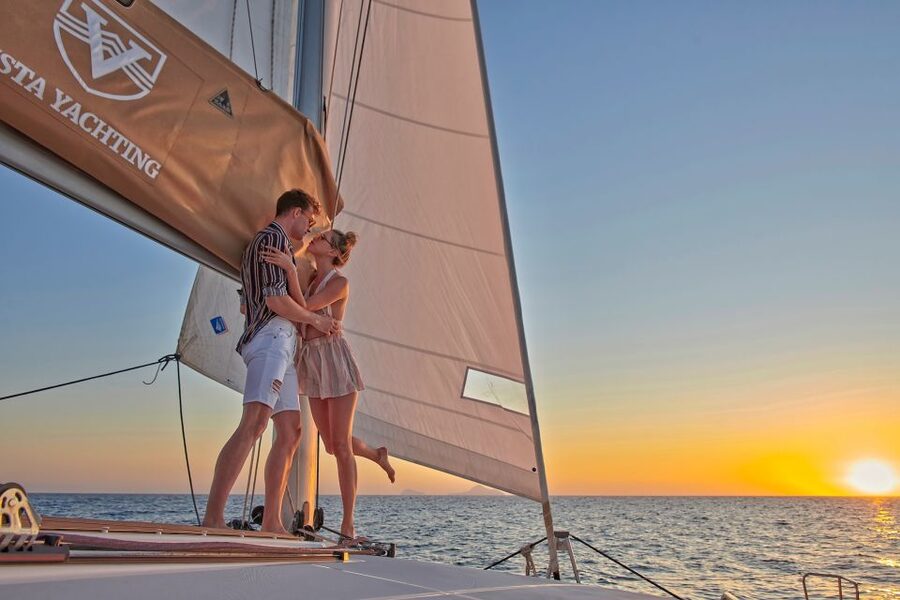 Santorini: Platinum Catamaran Cruise w/ BBQ Meal & Open Bar - Akrotiri Lighthouse and the caldera from sea level