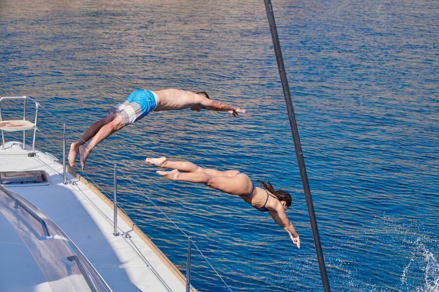 Santorini: Platinum Catamaran Cruise w/ BBQ Meal & Open Bar - Swimming at Palea Kameni hot springs