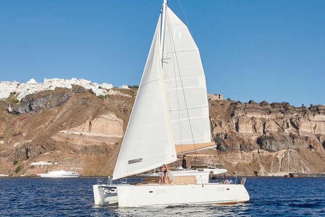 Santorini Platinum Catamaran Cruise with Meal, BBQ and Open Bar - The Akrotiri Lighthouse and Santorini’s Seafaring View