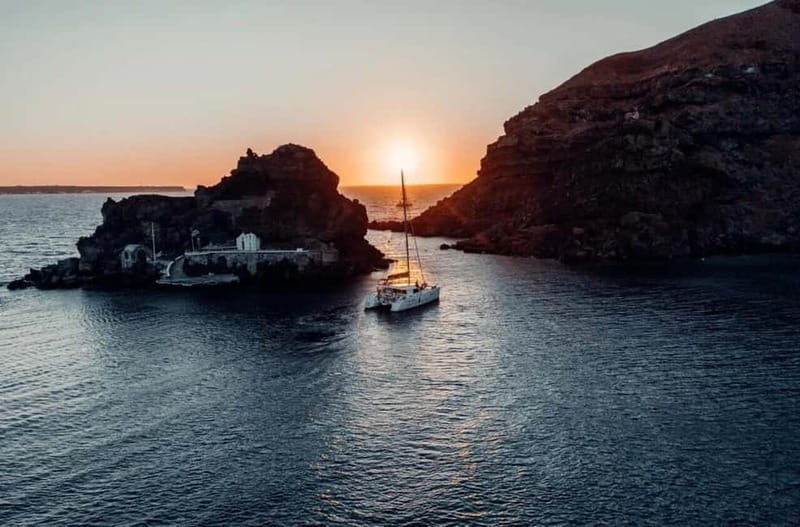 Santorini: Private Catamaran Cruise with BBQ Meal and Drinks - Starting Below the Cliffs at Ammoudi Bay