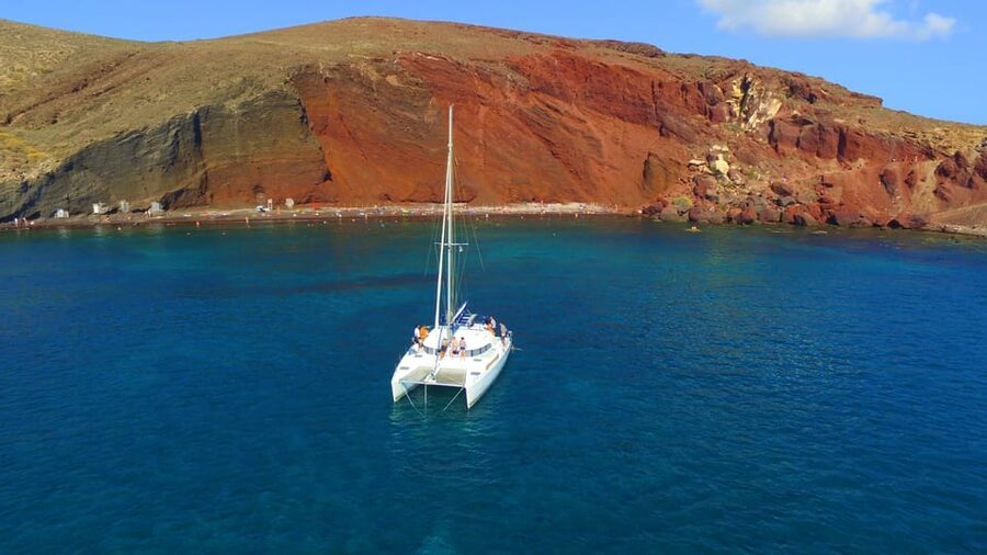 Santorini: Private Catamaran Cruise with Food & Drinks - Red Beach and White Beach from the water