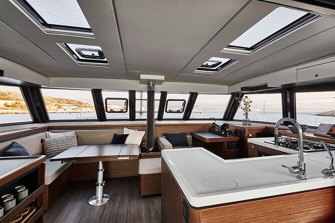 Santorini Private Tour Half-Day Sailing Platinum Catamaran Cruise - Oia from the sea, with a sunset question to clarify