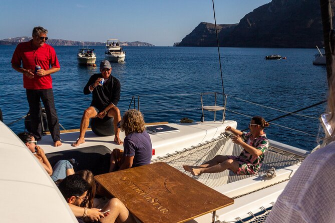 Santorini Sailing Catamaran Daily Cruises w/ Greek BBQ @Thirasia - The return to Vlychada with Champagne