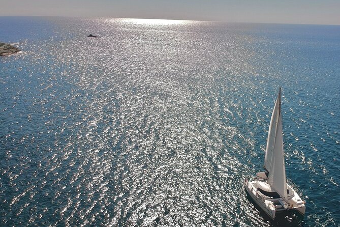 Santorini Sunset:Private All-In Catamaran Cruise (Food&Drinks) - Red Beach: your first swim stop