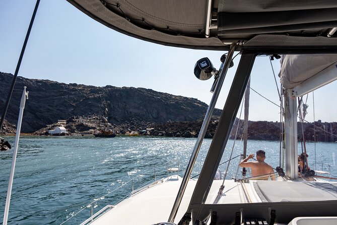 Semi Private Santorini Catamaran Tour - White Beach and Santorini’s pale volcanic cliffs