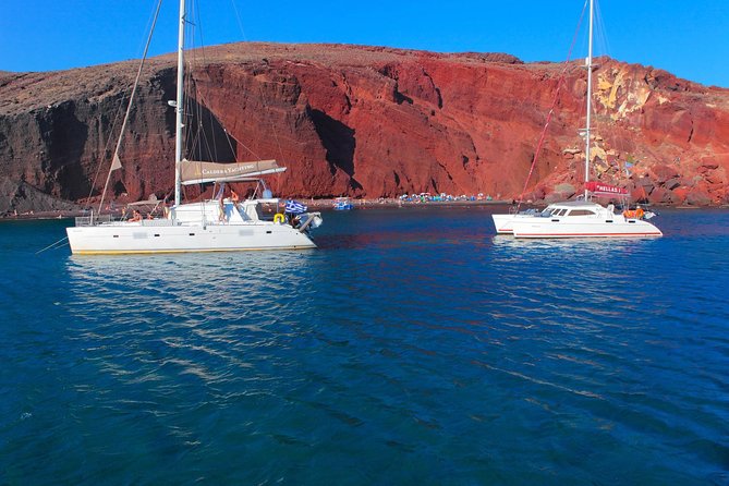 Shared Catamaran Romantic Sunset Cruise from Santorini via Volcano - One hour at dramatic Red Beach